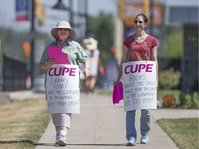 In this file photo, Essex County Library workers walk the picket line outside the LaSalle library on the first day of a strike, Saturday, June 25, 2016.