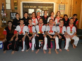 Five Brunelle Martial Arts members were national champs and 13 qualified for Team Canada following the World Karate Championship nationals in Ottawa. Front row, from left: Ranya Elashaal, Kyle Seguin, Grant Gauthier, Garret Gauthier, Steve Bonici, Matthew Smith, Steve Gombai; back row, from left: Victor Rizac, Vincent Crete, Lilly Gombai, Trista Gombai, Paul Rizac, Karina Boodram, Natasha Gombai, Rayan Elashaal, Musa Elashaal
