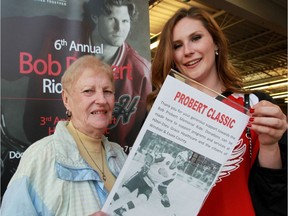 Theresa Probert, mother of legendary NHLer Bob Probert and his daughter Brogan, right, display an old photo of the former enforcer during the Probert Classic hockey game on June 3, 2016 at Tecumseh Arena. The event, which supports cardiac care in Windsor and Essex County, attracted NHL players past and present including Kris Draper, Dan Cleary, Adam Henrique, Dylan Larkin and Ryan Wilson.