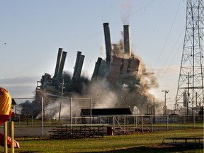 The former DTE Energy power plant is imploded Saturday, Nov. 7, 2015 in Marysville, Mich.