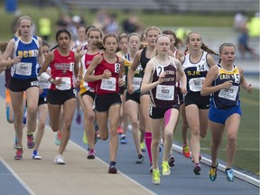 Runners compete in the midget girls' 3,000 metres at the OFSAA 2016 track and field championships at Alumni Field at teh University of Windsor on June 4, 2016.