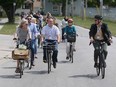Some of the urban planners, architects and other delegates to the 24th annual Congress for the New Urbanism in Detroit were given bikes on Thursday for a Windsor session on "Walkerville to Ford City: Neighbourhoods in Contrast."
