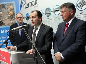 WINDSOR, ON.: JANUARY 19, 2015 --  Ontario Finance Minister Charles Sousa (right) is joined by Mayor Drew Dilkens and Nemak technical manager Glenn Byczynski (centre) during an announcement at the Nemak plant in Windsor on Monday, January 19, 2015. The plant is planning an expansion that will create 80 new jobs and begin shipping parts to China for a new GM product.       (TYLER BROWNBRIDGE/The Windsor Star)