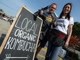 Shawn Slade, left, and Shannon Kamins are selling their Booch brand of organic kombucha. They are shown recently at the night market in Kingsville.