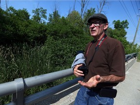 Amateur photographer Greg Nemeth takes a walk through the northern end of the Big Creek in Amherstburg on Wednesday, June 15, 2016. Nemeth is hoping the area will be protected.
