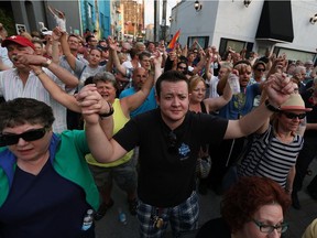 Jaxon Phillips (centre) and hundreds of others show their support for Orlando during a rally in Maiden Lane in Windsor on Wednesday, June 15, 2016.