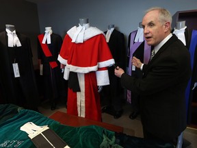 Ontario court Justice Douglas Phillips shows some of the items he has collected for a display on the legal history of Windsor at the Ontario Court in Windsor on June 2, 2016.