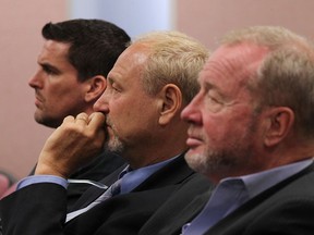 Rhys Trenhaile, left, Larry Horwitz and Paul Twigg listen in as city council debates the future of the Pelissier Street parking garage at city hall in Windsor on Monday, June 20, 2016.