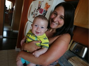 Robin Guiney holds  son Oliver at their home in Amherstburg,  on Thursday, June 23, 2016. Guiney is taking advantage of a new Meals for Moms program, which is similar to Meals on Wheels but for new moms.