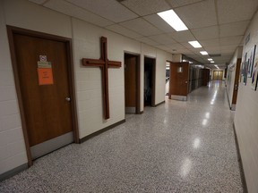 An empty and quiet hallway is seen at St. Bernard Catholic School in Amherstburg on Friday, June 24, 2016.