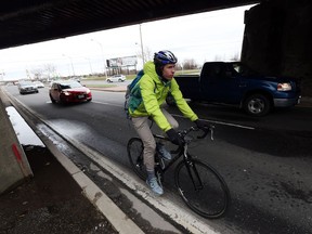 Cyclist Stephen Pitman braves the underpass on Dougall Avenue in Windsor on March 28, 2016.