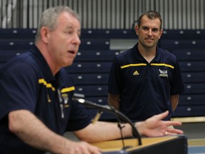 Director of athletics Mike Havey introduces Andy Hahn as the University of Windsor Lancers' new head coach of track and field and cross-country at a news conference at the St. Denis Centre in Windsor on May 26, 2016.