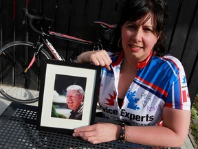 Windsor's Liindsay Gammon, holds a picture of her late father Ron, who will be her inspiration during this weekend's Enbridge Ride to Conquer Cancer. The 200-km team event runs from Toronto to Niagara Falls.