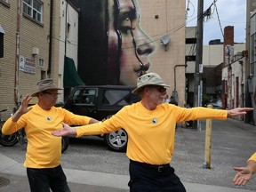 David Groff, left, and Wayne Patzalek, members of Fung Loy Kok Taoist Tai Chi group, perform on Maiden Lane during a kickoff to Afternoons in the Alley presented by the Downtown Windsor BIA on June 14, 2016.