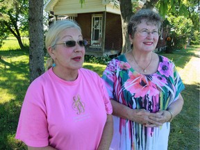 Rose Tako, left, owner of 6450 County Road 42, was joined by her sister Fran Tako-Ferguson Friday June 17, 2016. The property has been expropriated by City of Windsor.