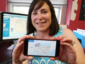 Data analyst Allison Charko displays a new app called MyNewCity designed to help   refugees access services and adjust to life in their new city.