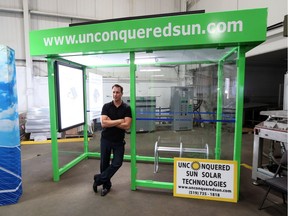 Unconquered Sun Solar Technologies founder Sean Moore  unveils a solar powered transit shelter at the Tecumseh, Ontario business on June 30, 2016.