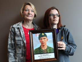 Theresa Charbonneau, left, volunteer with HOPE and mother of Cpl. Andrew Grenon, killed in Afghanistan in 2008, and Margit Simon, mother, holding a photo of her son Jason Simon, who committed suicide in February 2016.