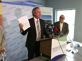 Municipality of Chatham-Kent Mayor  Randy Hope, left, and Town of Tecumseh Mayor Gary McNamara  speak to the media during a press conference regarding a leaked provincial document on natural gas.   The press conference was held at the Windsor-Essex Regional Chamber of Commerce office.