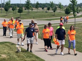 LaSalle Mayor Ken Antaya joins a walking group  during the County Wide Active Transportation System celebration near the Vollmer Complex in LaSalle, Ont., on May 31, 2016.