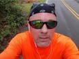 Windsor's Matt D'Asti takes a selfie while running the Bayshore Marathon in Traverse City, Mich., on Saturday, May 28, 2016.