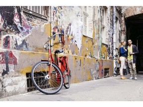 Young couple in alley. Photo by Getty Images.