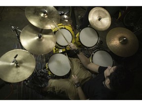 Elevated view of young man playing drums. Photo by Getty Images.