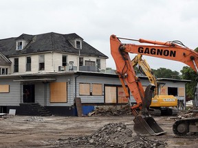 Staff with Gagnon Demolition at Abars Tavern on Riverside Drive East Monday July 18, 2016.