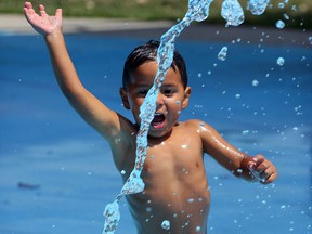 Mateo Calito, 2, heads for a stream of water during an afternoon of fun with his family at Mic Mac water park Wednesday July 20, 2016.