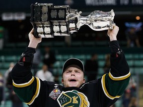 Max Jones (49) of the London Knights hoists the Memorial Cup after defeating the Rouyn-Noranda Huskies during the 98th Memorial Cup final on May 29, 2016 at the Enmax Centrium in Red Deer, Alta.