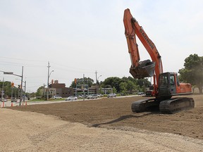 A heavy equipment operator levels the land on Thursday, July 28, 2016, where Abars used to stand at the corner of Riverside Drive and Lauzon Road. The decades old landmark was demolished. The property is owned by American billionaire businessman Matty Moroun.