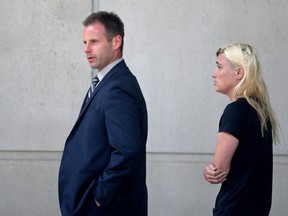 Windsor defence lawyer Evan Weber and Christina Albini leave Ontario Provincial Court on July 19, 2016. Albini is charged with sexual assault, sexual interference with a person under 16 and invitation to sexual touching and child luring.