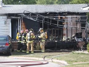 Amherstburg firefighters work the scene of an explosion at a home on Malden Hill Drive in Amherstburg, Ont., on July 28, 2016.