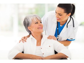 Caring doctor with senior patient. Photo by Getty Images.