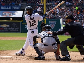 Anthony Gose hits one to the outfield in during the Tigers' home opener at Comerica Park in Detroit on Friday, April 8, 2016.