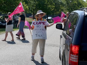 Librarians represented by CUPE walk the picket line at the Essex Civic Centre.