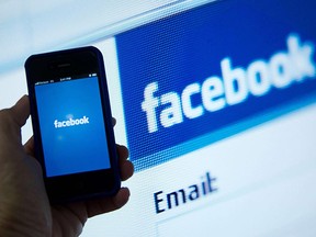 Facebook's logo and mobile app are shown in this 2012 file photo.