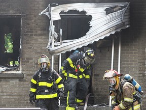 Five people were displaced after fire ripped through a semi-detached home in the 2200 block of College Ave. on Wednesday, July 6, 2016, in Windsor, Ont. Windsor firefighters are shown at the scene of the fire.