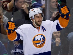 New York Islanders' Frans Nielsen celebrates after scoring against the Vancouver Canucks in Vancouver, B.C., on Monday March 10, 2014.