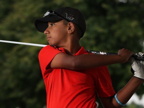 Shawn Sehra practises his swing at Silver Tee Golf Centre on July 27, 2013.