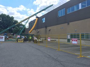 A worker was rushed to hospital after he fell through the roof at the GoodLife Fitness on Dougall Avenue in Windsor on July 15, 2016.