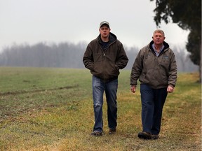Award-winning farmers Neal Huber, left, and his father, Don Huber, at their Harrow area farm Dec. 8, 2015.