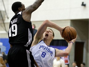 Detroit Pistons' Henry Ellenson (8) tries to make a shot against Orlando Magic White's Alex Davis (19) during the second half of an NBA summer league basketball game on  July 8, 2016, in Orlando, Fla.