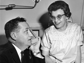 In this April 9, 1963 file photo, Eugene Whelan former Liberal MP for Essex South is shown in the maternity ward in Metropolitan Hospital alongside his wife, Liz, who was in hospital expecting their second child.