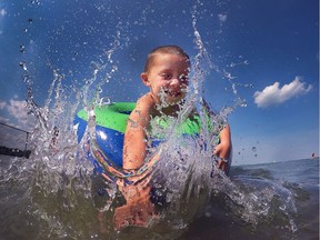 Crushing heat was no problem on Wednesday, July 27, 2016, for James Walsh, 4, who was cooling down at the Sandpoint Beach with his family.