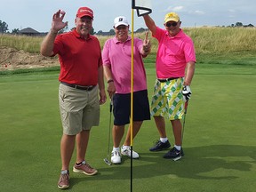 Don Kenney, left, had a hole-in-one at the Seven Lakes Championship course while competing in the Chrysler Data Processing Golf League. He used a 52-degree wedge on the Par-3 15th hole from 121 yards. The witnesses were Garry Bate, middle, Fred Gagnon, right, and Mark Neilson.