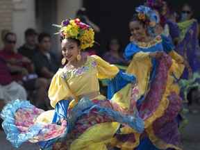 Dancers with the Joyas de Mexico Dance Troupe perform at Fiesta Latina on Maiden Lane in downtown Windsor, Saturday, July 30, 2016.