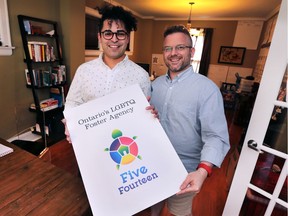 Lucas Medina, left, executive director, and Chad Craig, operations director of Five/Fourteen are shown on Tuesday, July 5, 2016, at their Windsor, Ont., home office. Their service, which is the first of its kind in Canada, helps find foster care for LGBTQ youth.