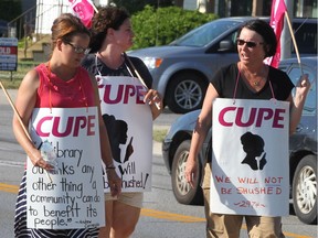 Striking CUPE library staff picket in front of the Tecumseh municipal building on Tuesday, July 12, 2016.