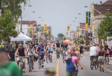 Cyclists and pedestrians in Walkerville enjoy 8km of streets closed to motor vehicles during Open Streets Windsor, Sunday, July 17, 2016.